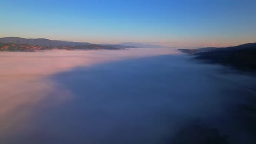 4K Aerial view of Mountains landscape with morning fog.