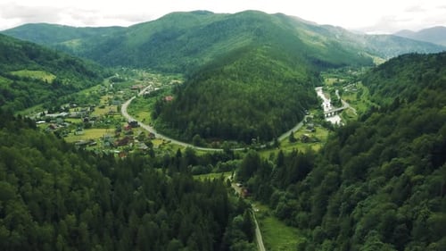 Aerial View of Green Mountains and Winding Roads