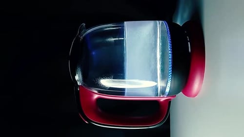 Vertical Rapid Footage of Water Bubbles in Hot Water Boiling Inside Misted Glass Teapot in Office
