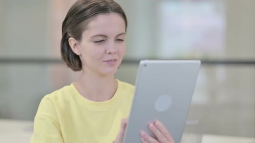 Woman Using Tablet in Office Workplace