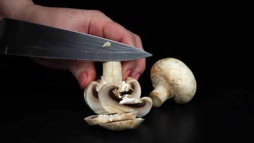Slicing Fresh White Mushrooms With Knife Close Up