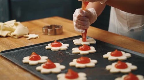 Confectioner makes pastries in the kitchen
