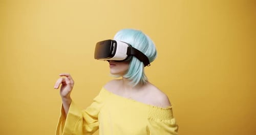 Woman Using VR Headset and Interacting with Interface