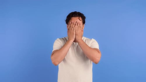 Man Celebrating Success on a Blue Background