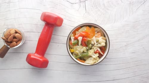 Healthy Lifestyle with Vegetables, Apple and Dumbbell