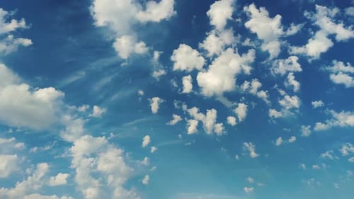 Fluffy White Clouds Against a Blue Sky