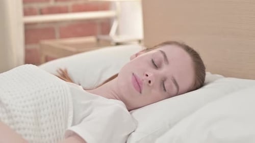 Attractive Redhead Young Woman Getting Out of Bed