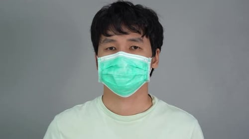 young man wearing surgical mask (medical mask), virus protection.