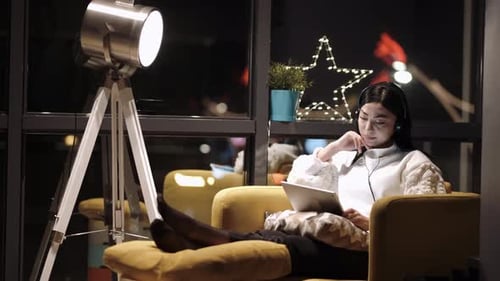 Woman Watching Video From Tablet