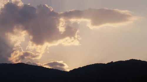 Clouds Moving Over Mountains at Sunrise Time Lapse