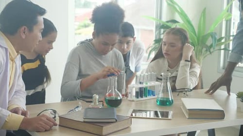 Students Perform Science Experiment in Bright Classroom