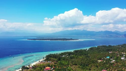 Aerial drone shot sky of tropical shore beach vacation by blue green lagoon and white sandy backgrou
