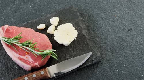 Raw Steak with Garlic and Rosemary