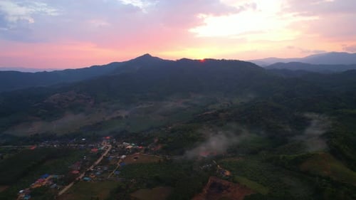 Aerial view from a drone over a misty landscape on the farmland
