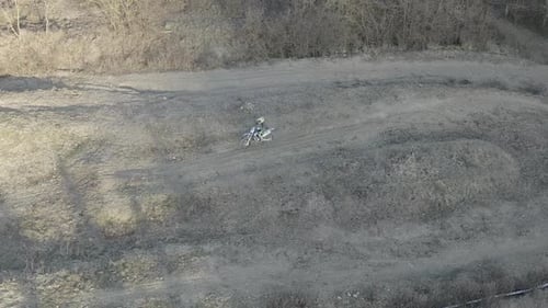Aerial view of a motocross rider on a dirt track
