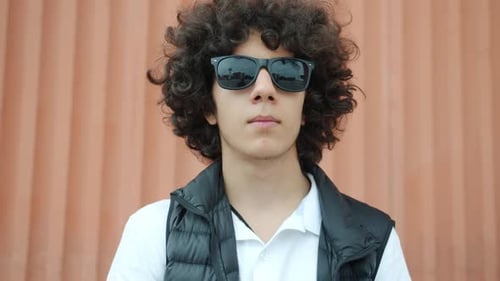 Young Adult Posing with Sunglasses in the City