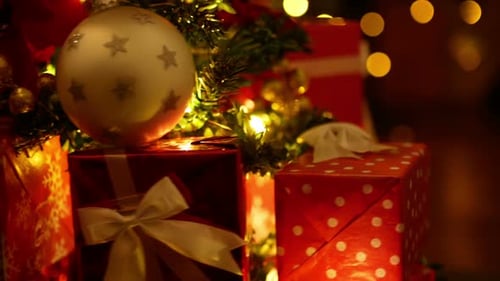 Christmas Tree Decorated with Gifts and Holiday Lights