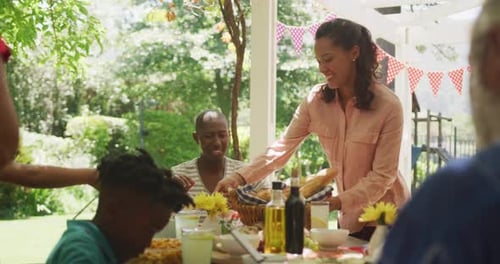 Multi-generation African American family spending time in garden together
