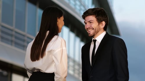 Business People Shaking Hands at Office Building
