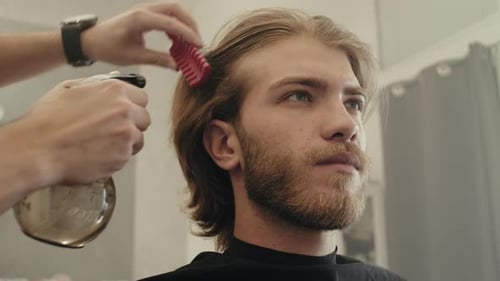 Man Getting Haircut in Barbershop Close Up