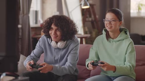 Teen Friends Enjoy Playing Video Games Together