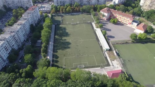 Footballl Stadium in the City Between the Blocks