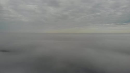 Flying over clouds. Video shot by drone in early morning
