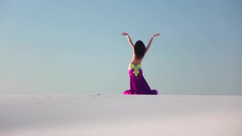 Woman Belly Dancing in a White Desert