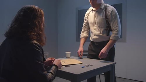 Police Interrogation with Suspect in Dark Room