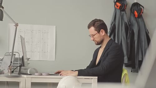 Male Engineer Working in Design Office