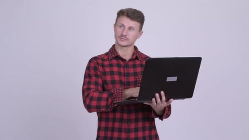 Man Works On Laptop Then Has An Idea