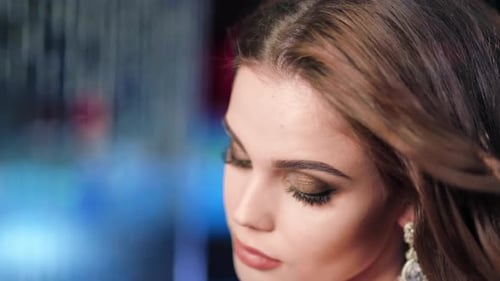 Attractive Young Woman Posing with Glamorous Makeup