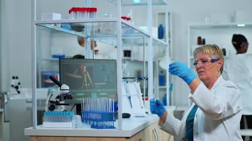 Scientist Examining Test Tube in Modern Laboratory