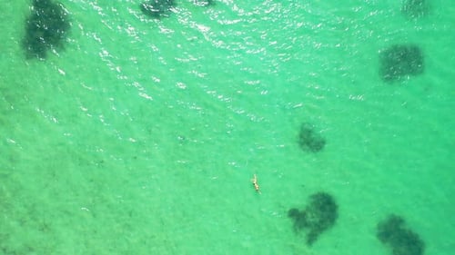 Wide flying tourism shot of a sandy white paradise beach and turquoise sea background in best qualit