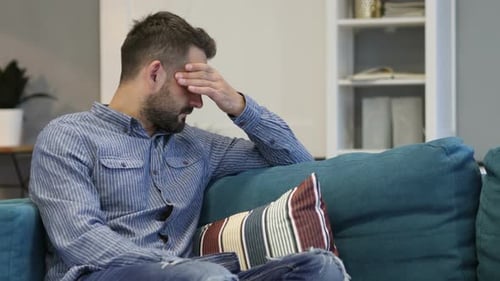 Tired Man Sitting with Headache, Pain