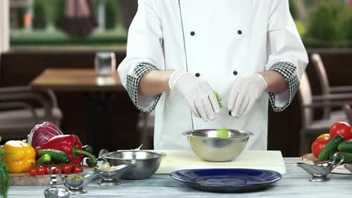 Chef Preparing Garden Salad With Fresh Ingredients