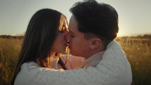 Loving Couple Embracing in Golden Sunset Light