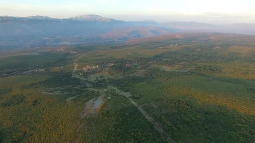 Aerial view of remote village in green valley