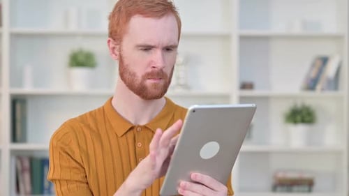 Young Adult Using Tablet at Home
