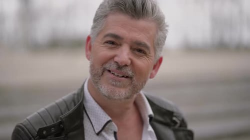 Smiling Man in Leather Jacket Close Up Portrait