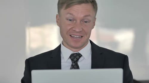 Close Up of Online Video Chat By Businessman at Work