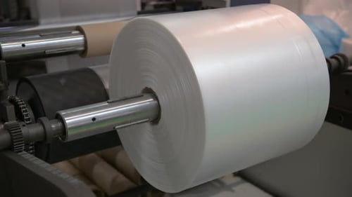 Tambour de réception et rouleaux d'alimentation de la machine d'extrusion