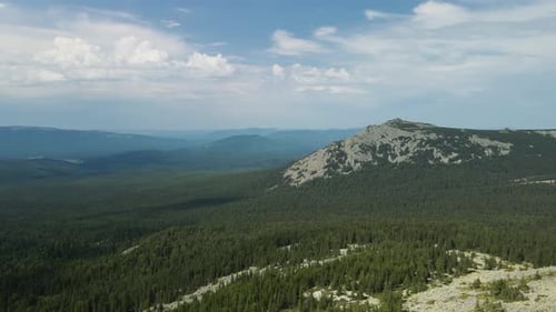 Beautiful mountain of stones among the forest view from a height