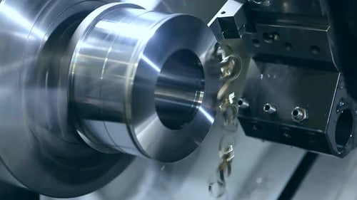 Metal Lathe Shaping Object in Manufacturing Setting