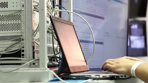 Technician Working on Network Servers and Data