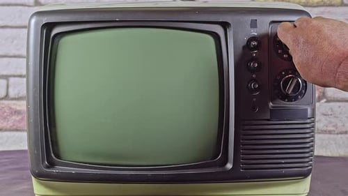 Hand Tuning Dial on Vintage Television