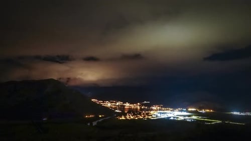 Night to Day Time Lapse of City and Mountains