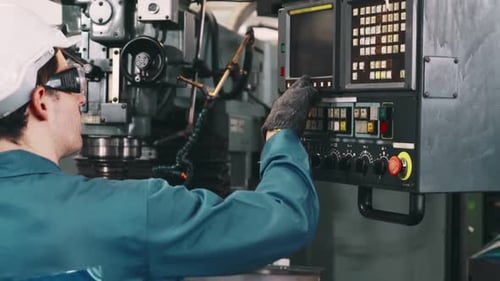 Smart Factory Worker Using Machine in Factory Workshop