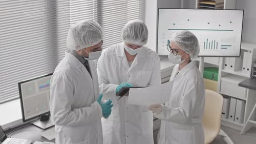 Scientists Having Discussion in Lab