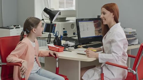 Child Consults with Doctor in Medical Office